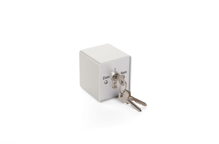 A small, gray lockbox with a set of two keys inserted into the keyhole, showing the "Close" and "Open" positions—ideal for controlling door automation systems.