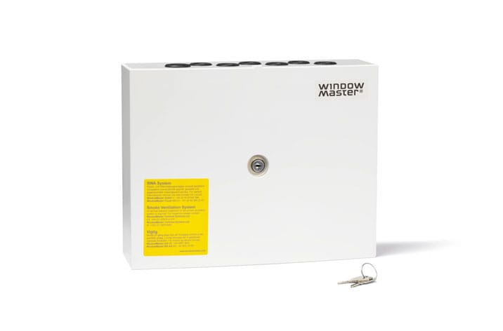 A white WallMaster control box labeled "WindowMaster" with a yellow instruction label and a keyhole, accompanied by two keys, ideal for integrating window actuators for efficient natural ventilation.