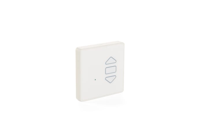 A white rectangular device with three buttons featuring blue arrows pointing up and down, likely a remote or control panel for window actuators.