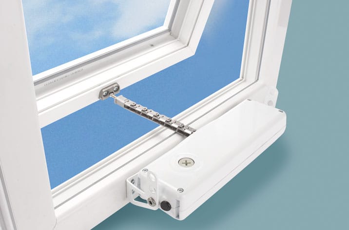 A close-up of a white mechanized window opener with a chain mechanism, attached to an open window, showing a blue sky in the background—perfect for enhancing natural ventilation.