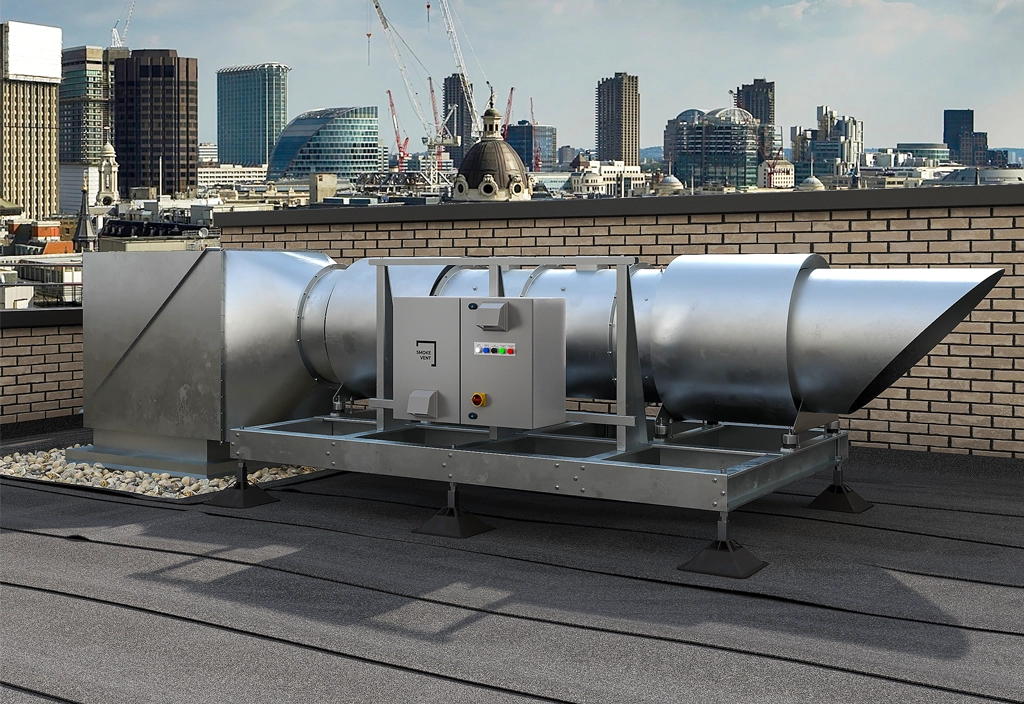 Industrial metal ventilation duct system on a rooftop with a city skyline in the background.